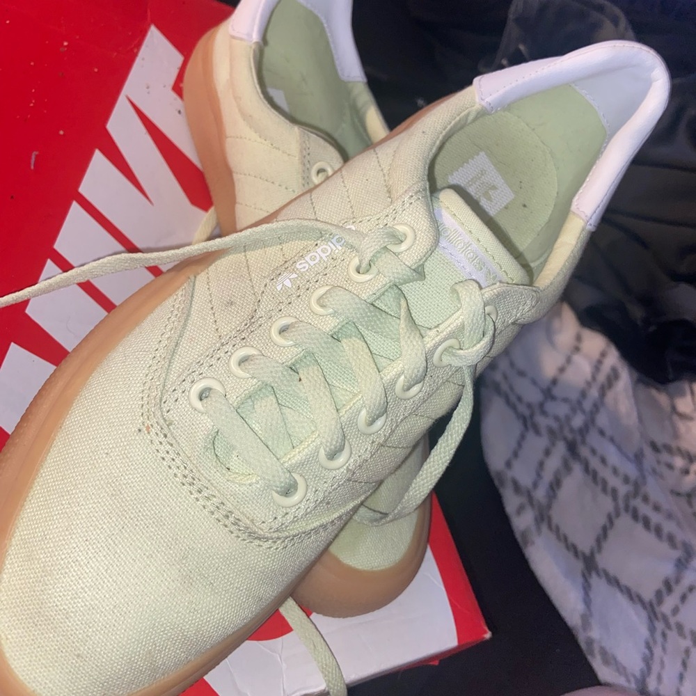 Green adidas skater shoes